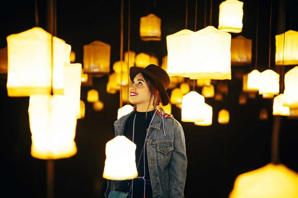 closeup shot happy young lady room with many bright chandeliers 181624 44491.jpg